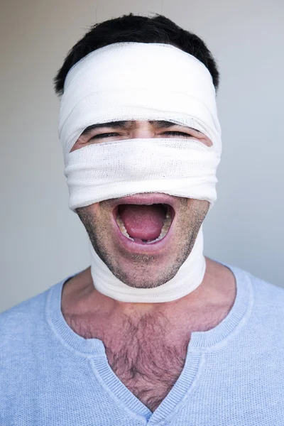 Screaming man with bandages