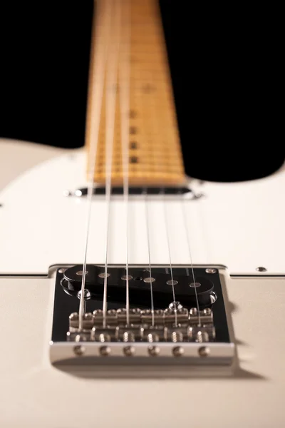 Close-up of a silver electric guitar body
