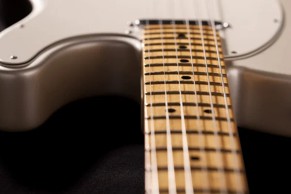 Close-up of electric guitar body and neck