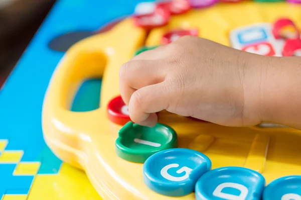 Children\'s Hand  to play alphabet games