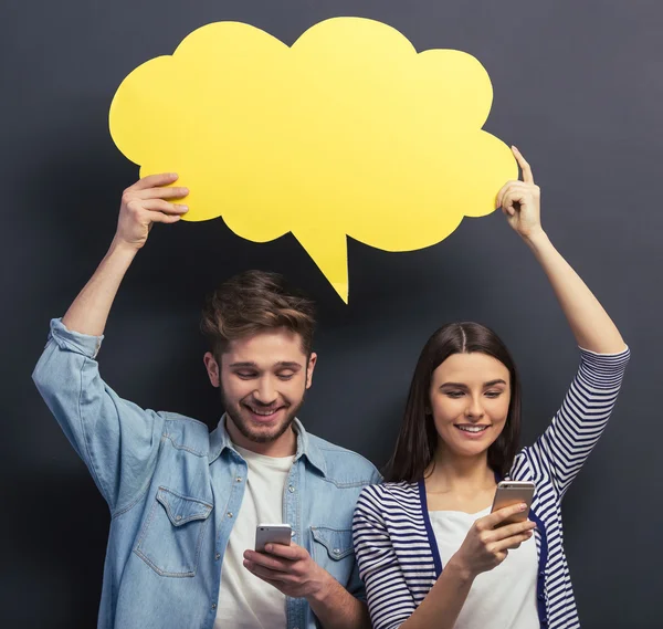 Young couple with speech bubbles