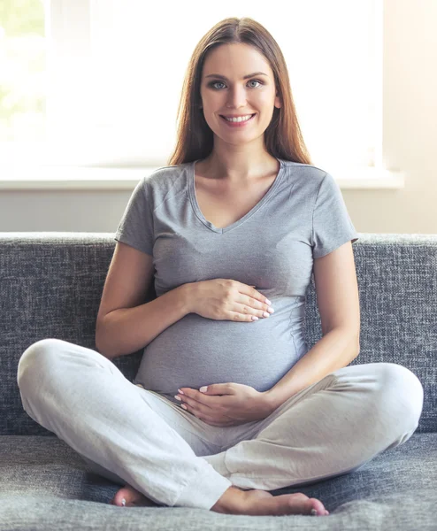 Beautiful pregnant woman at home