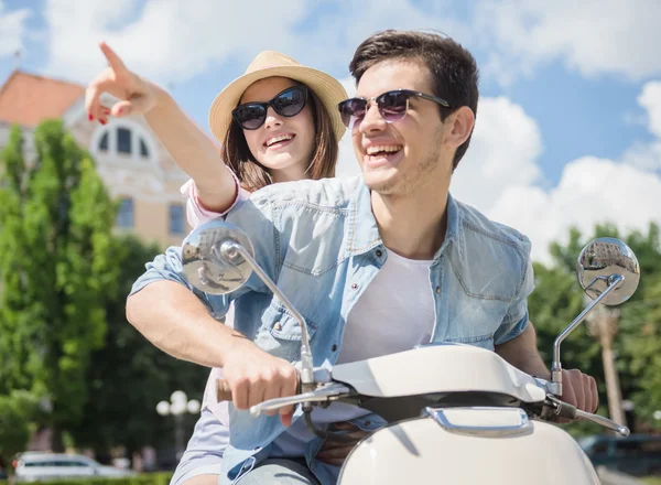 Young couple on scooter