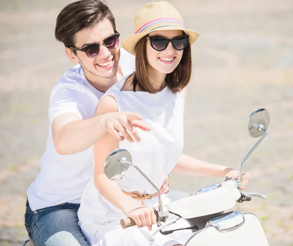 Young couple on scooter