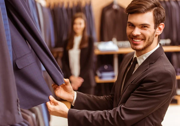 People in suit shop