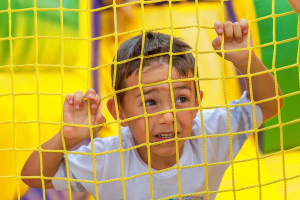 Little kid playing around the playground