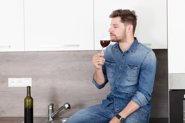 Young man with wine.