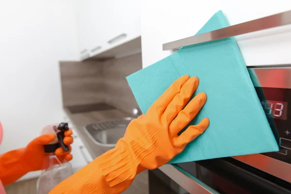 Housework. Tidying up and cleaning the kitchen.