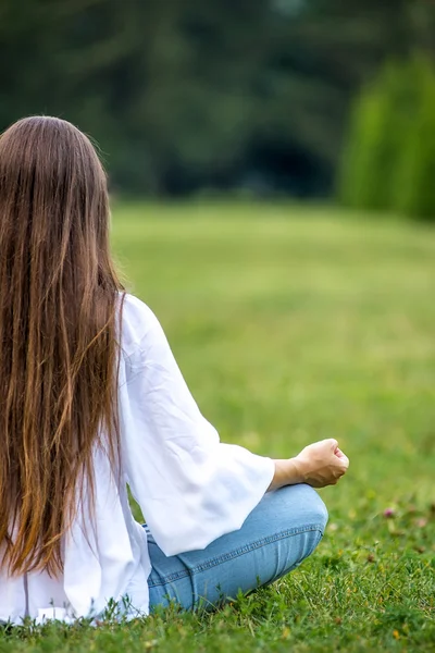 Pregnant woman in the park.