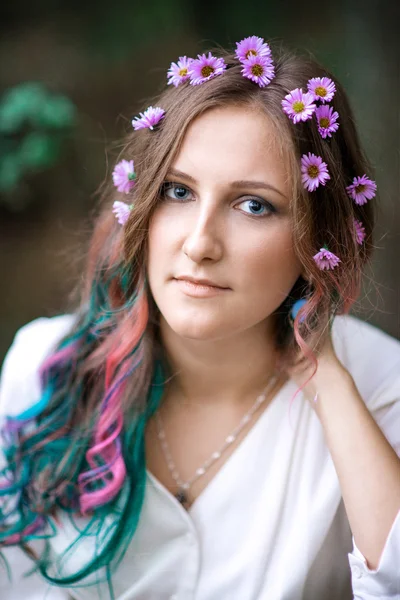Portrait of a young woman with multicolored hair
