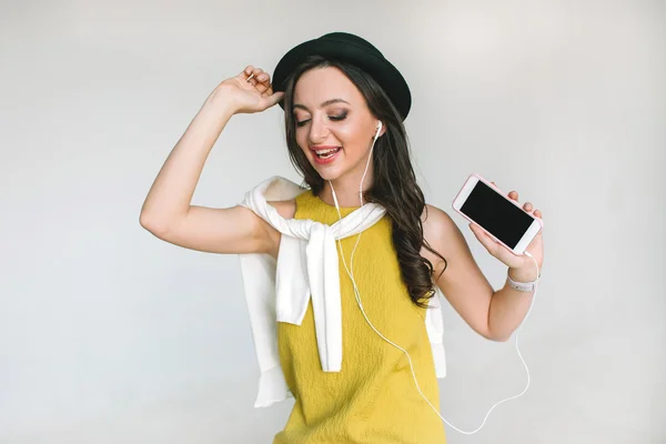 Young pretty woman listen to music app using smartphone