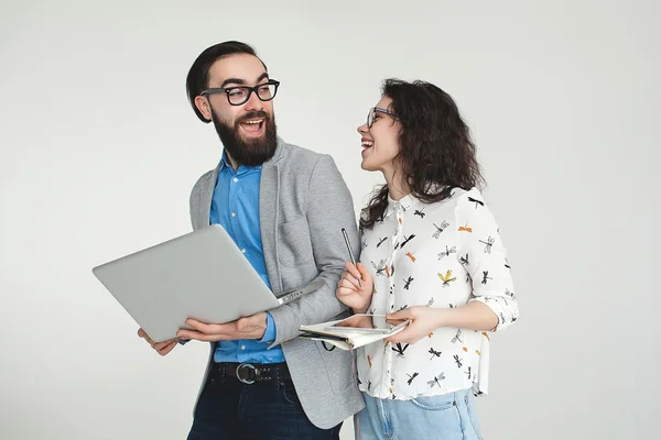 Hipster team in glasses with laptop tablet isolated on white