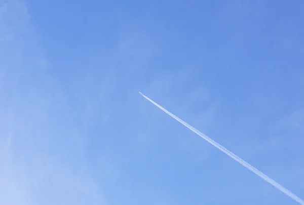 Plane flying high in the sky above  earth.