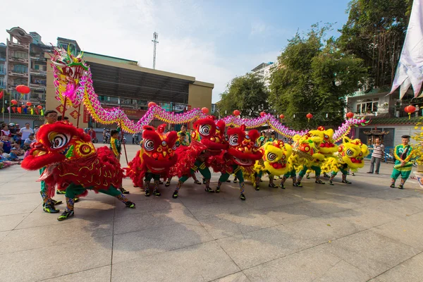 Ho Chi Minh City, Vietnam - February 18, 2015: A show of lion or dragon dance  at Pagoda, China Town, District 5, Cho Lon to praying heathty, safety and lucky during the lunar new year