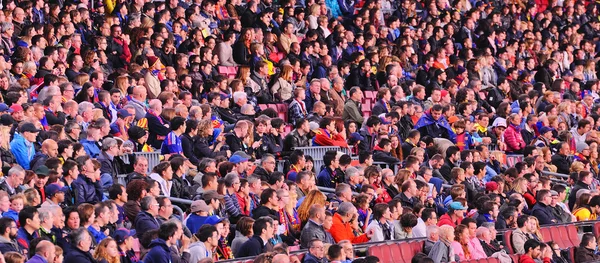 People supporting F.C. Barcelona footballers