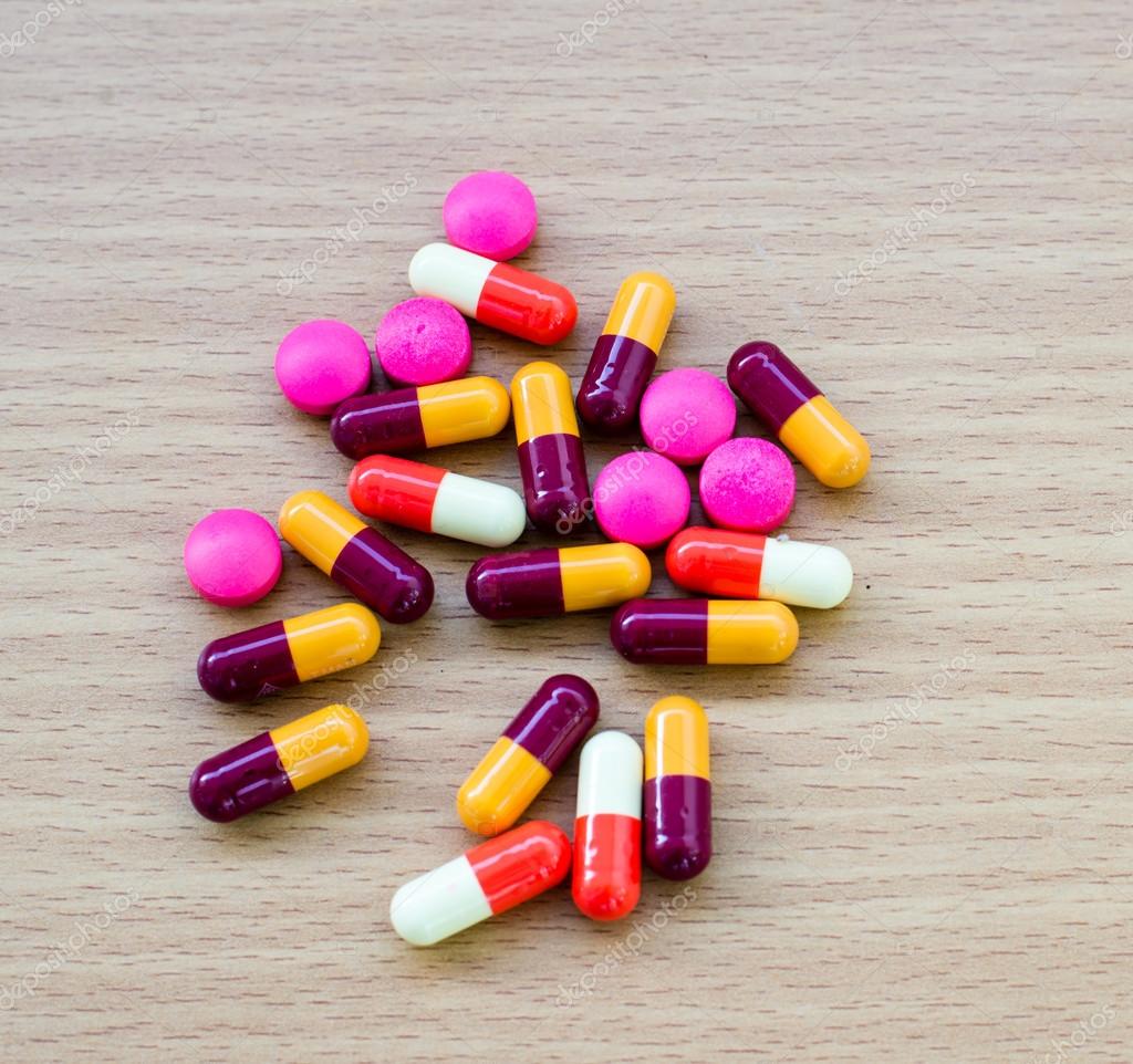 Diferent Tablets pills capsule heap mix therapy drugs doctor flu