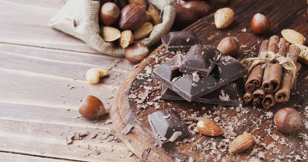 Pieces of chocolate with nuts and cinnamon