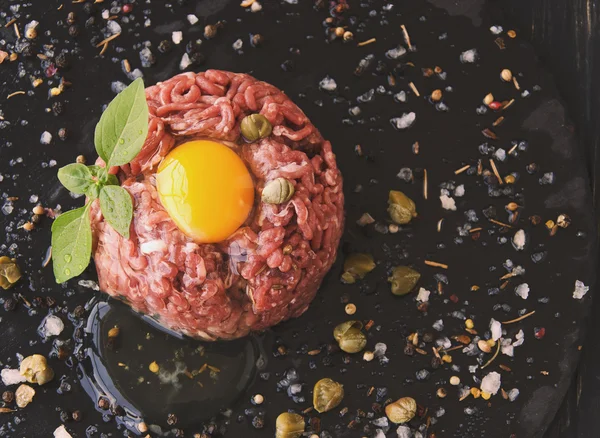 Steak tartare of raw minced meat with salt and spices