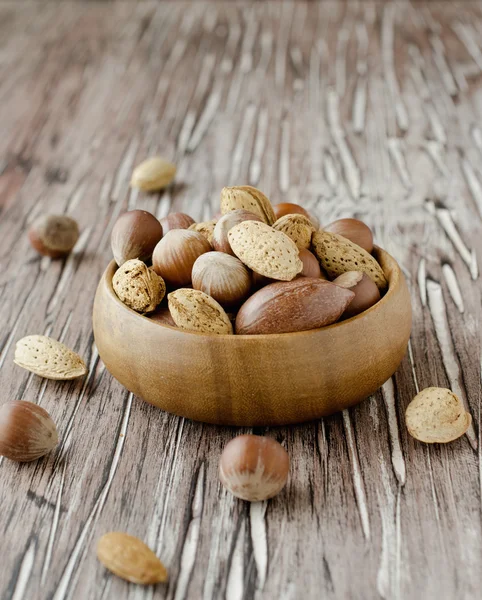 Canvas bag with nuts on a wooden table