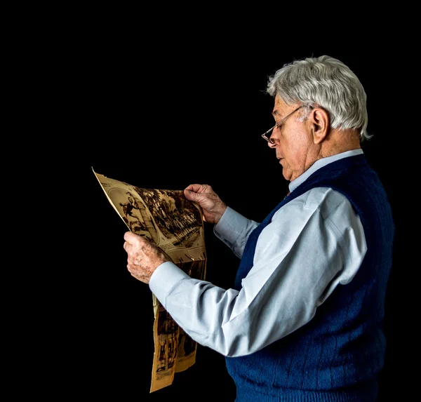 Older Man Reading Newspaper