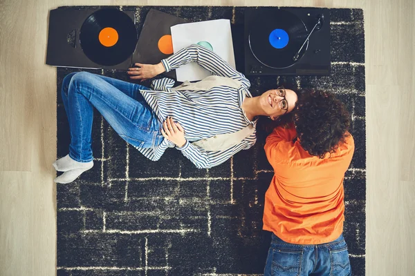 Happy young couple listening to music - vinyl