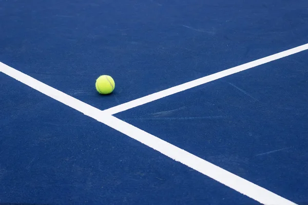 Tennis ball on tennis court