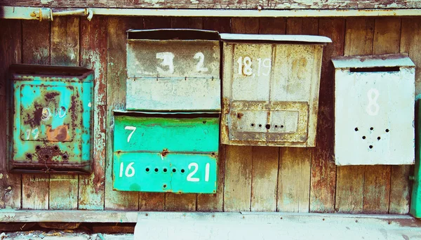 Old memory mailboxes concept. Multicolored old shabby mailboxes