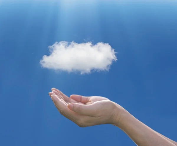 Woman hand  under cloud on blue background, cloud computing concept