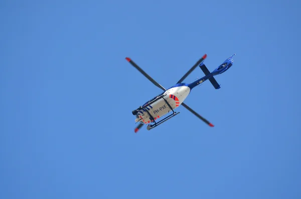 Police helicopter in blue sky