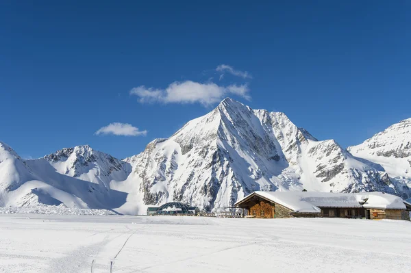 Winterlandscape with ski lodge