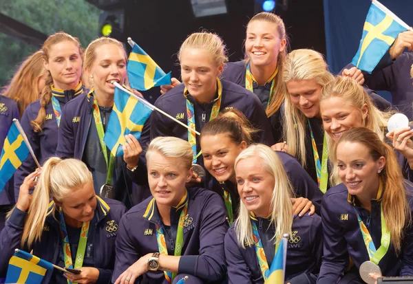 Swedish female soccer team showing their silver medals from the