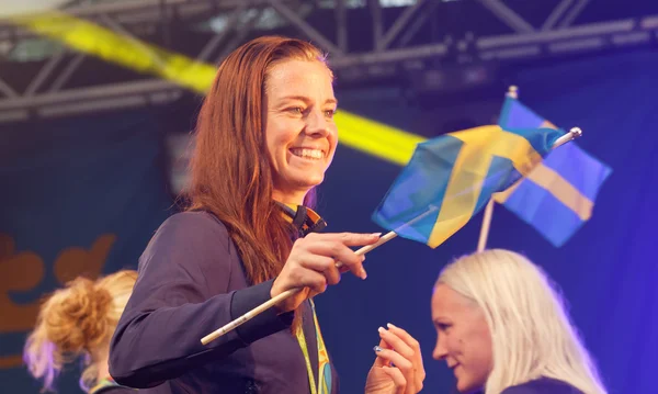 Swedish soccer player Lotta Schelin waving the swedish flag