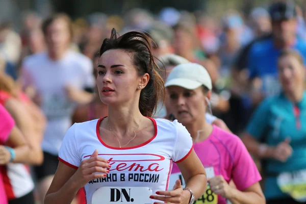 Young beautiful woman running