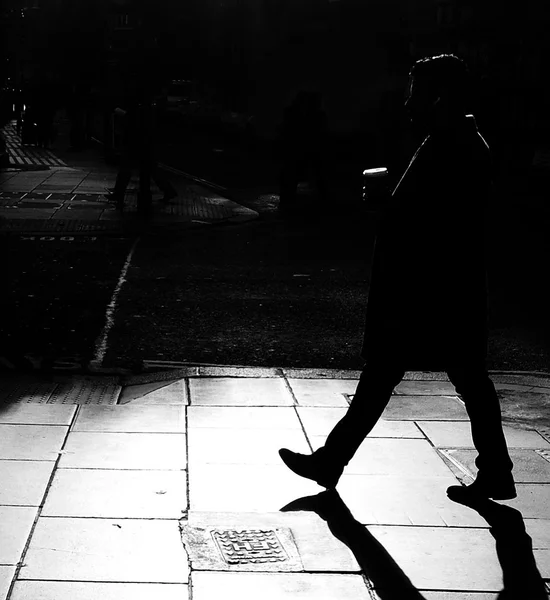 Silhouettes of a man walking