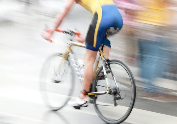 A very bicycling man, blue and yellow