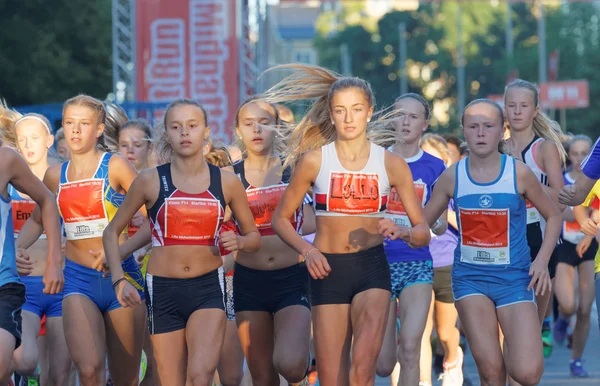Large group of running girls and boys close-up
