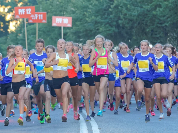 Group of running girls and boys