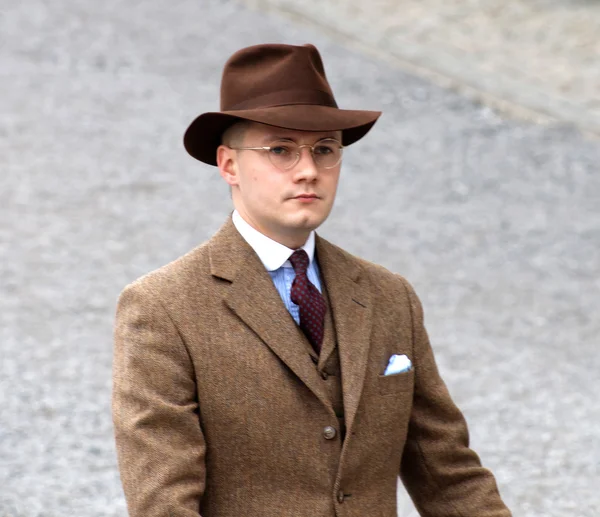 Man wearing old fashioned brown tweed clothes