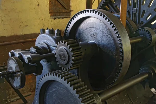 Old lathe with belt drive in an old factory