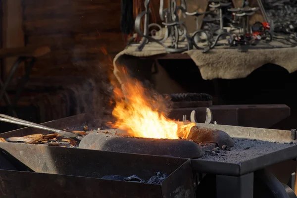 Fire used by the blacksmith in the forge