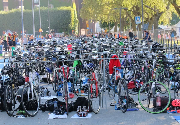 Many colorful bicycles parked in the triathlon transition zone