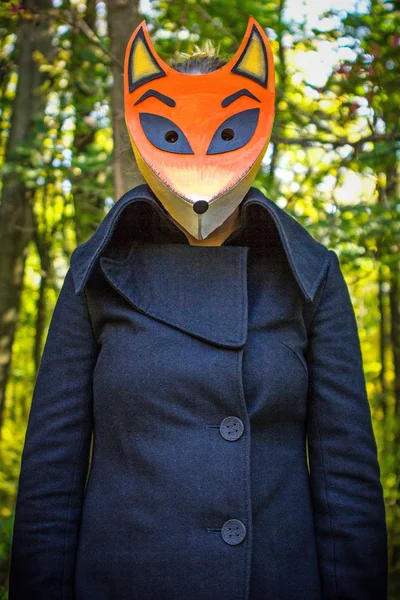 Woman wearing fox mask