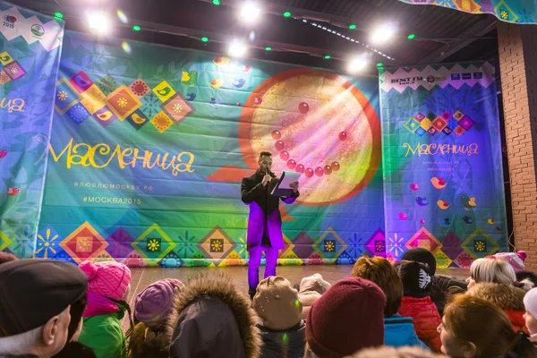 Maslenitsa (pancake week). The host announces the beginning of the competition.