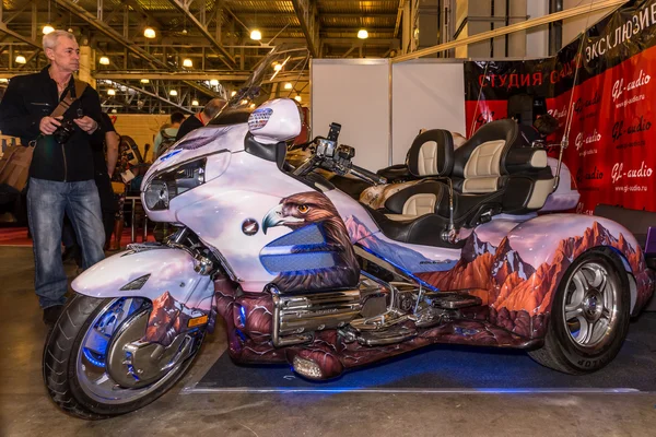 Motopark-2015 (BikePark-2015). The exhibition stand of the studio GL-Audio. Tricycle (Trike) Honda. Visitors are looking the stand.