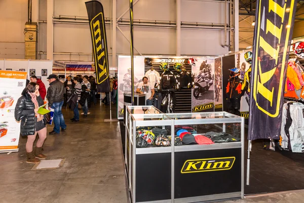 Motopark-2015 (BikePark-2015). The exhibition stand of the store of Moto gear Klim. Visitors of the exhibition.