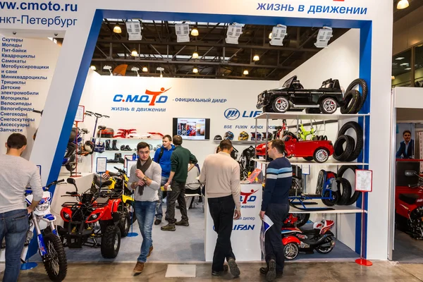 Motopark-2015 (BikePark-2015). The exhibition stand of C.Moto. Visitors are watching the stand.