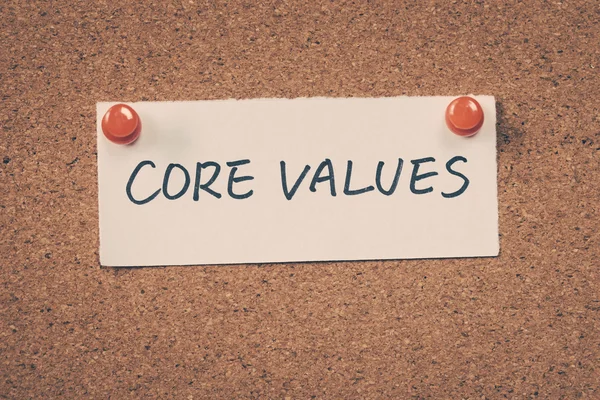 Core values note pinned on the bulletin board