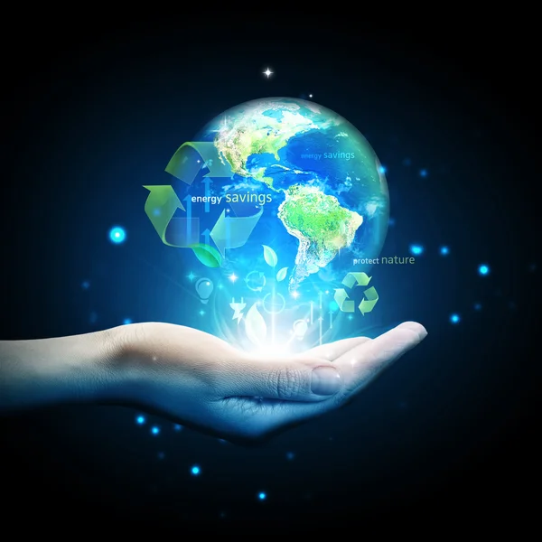World globe on hand with energy saving concept