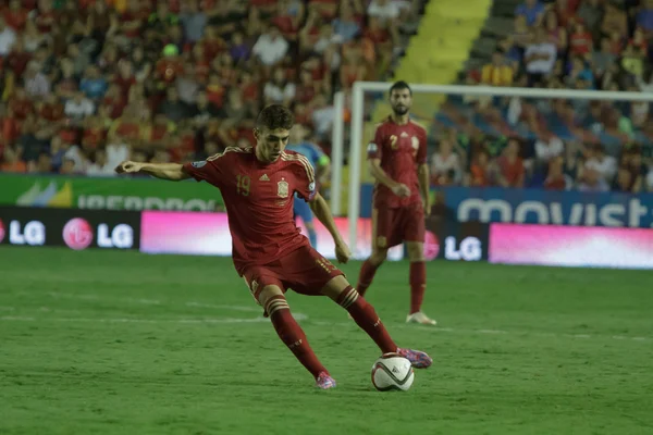 Forward Munir El Haddadi on his debut for Spain with a ball
