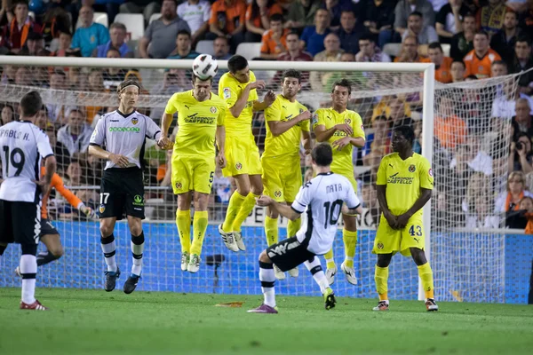 Juan Manuel Mata takes a free kick